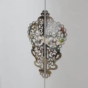 szafa glamour z dużym ornamentem chrom